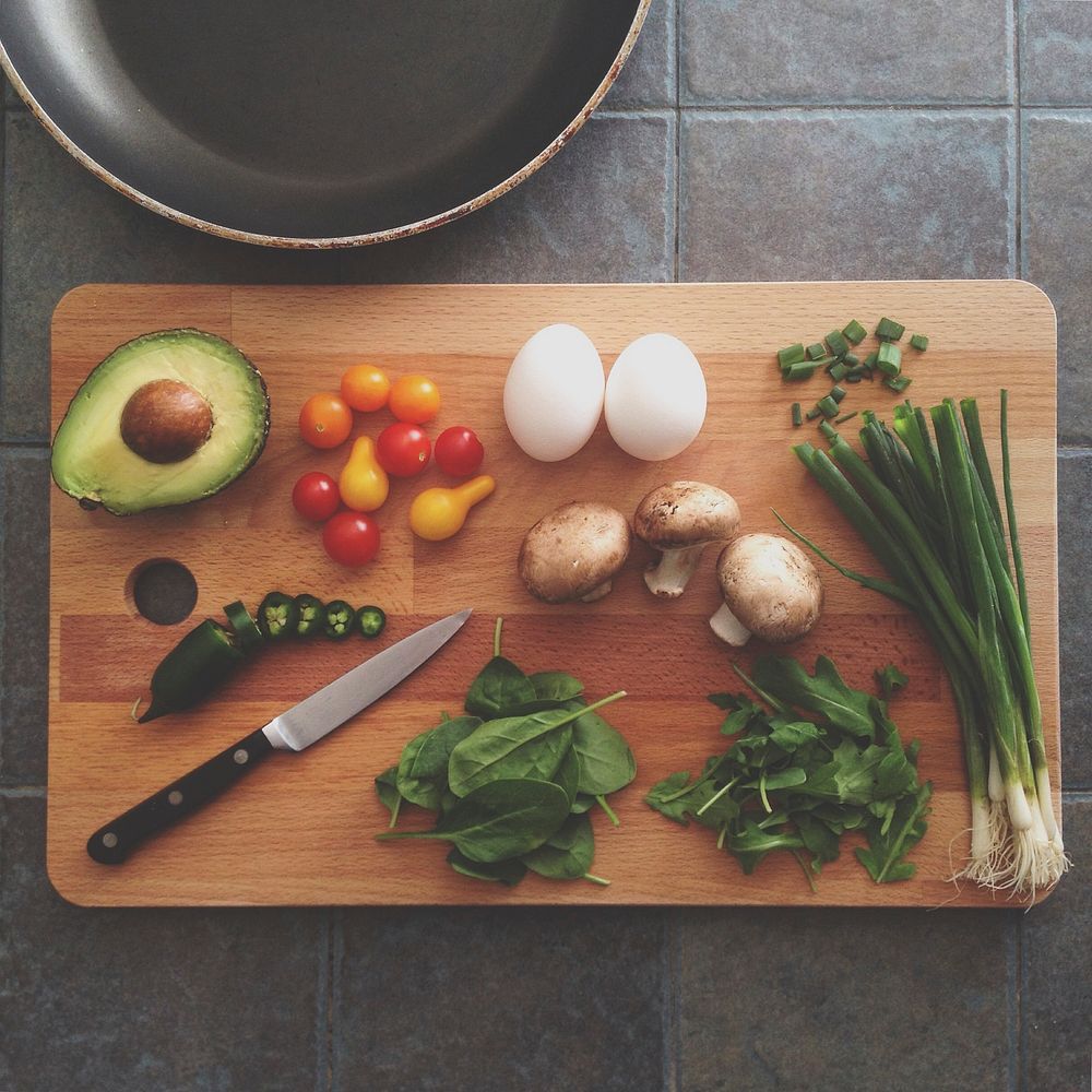 Flat lay of fresh ingredients with avocado, herbs, jalapeno, and egg. Original public domain image from Wikimedia Commons