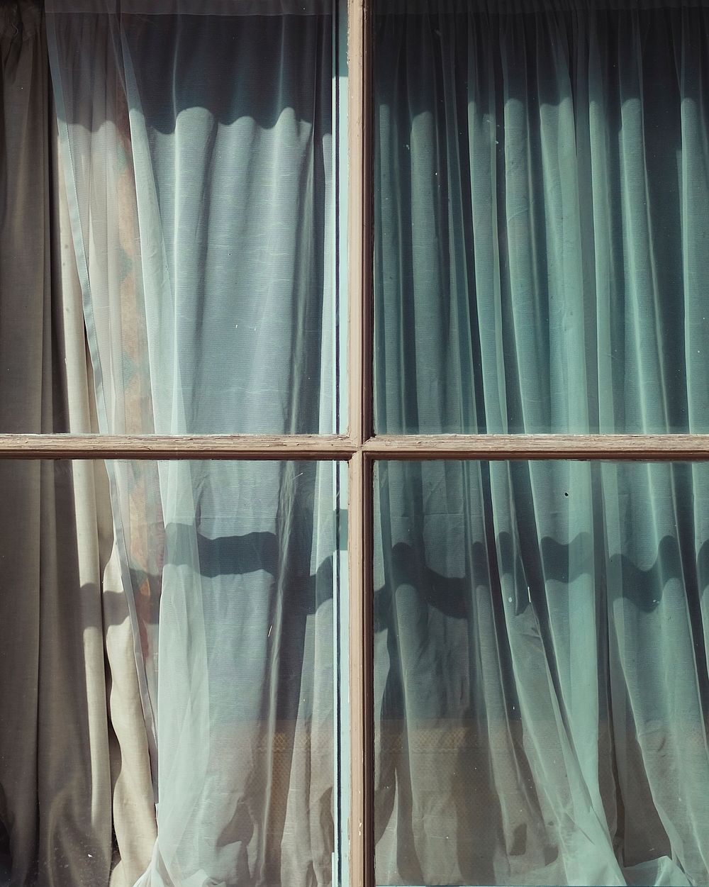 A curtain seen through a window. Original public domain image from Wikimedia Commons