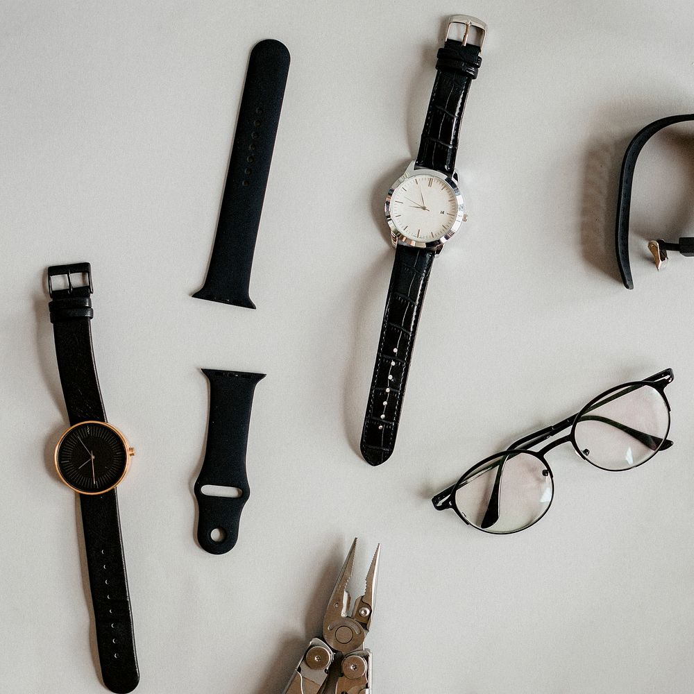 Watches and a plier on a table
