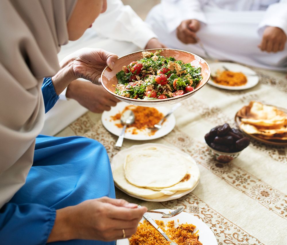 Muslim family having dinner on the floor