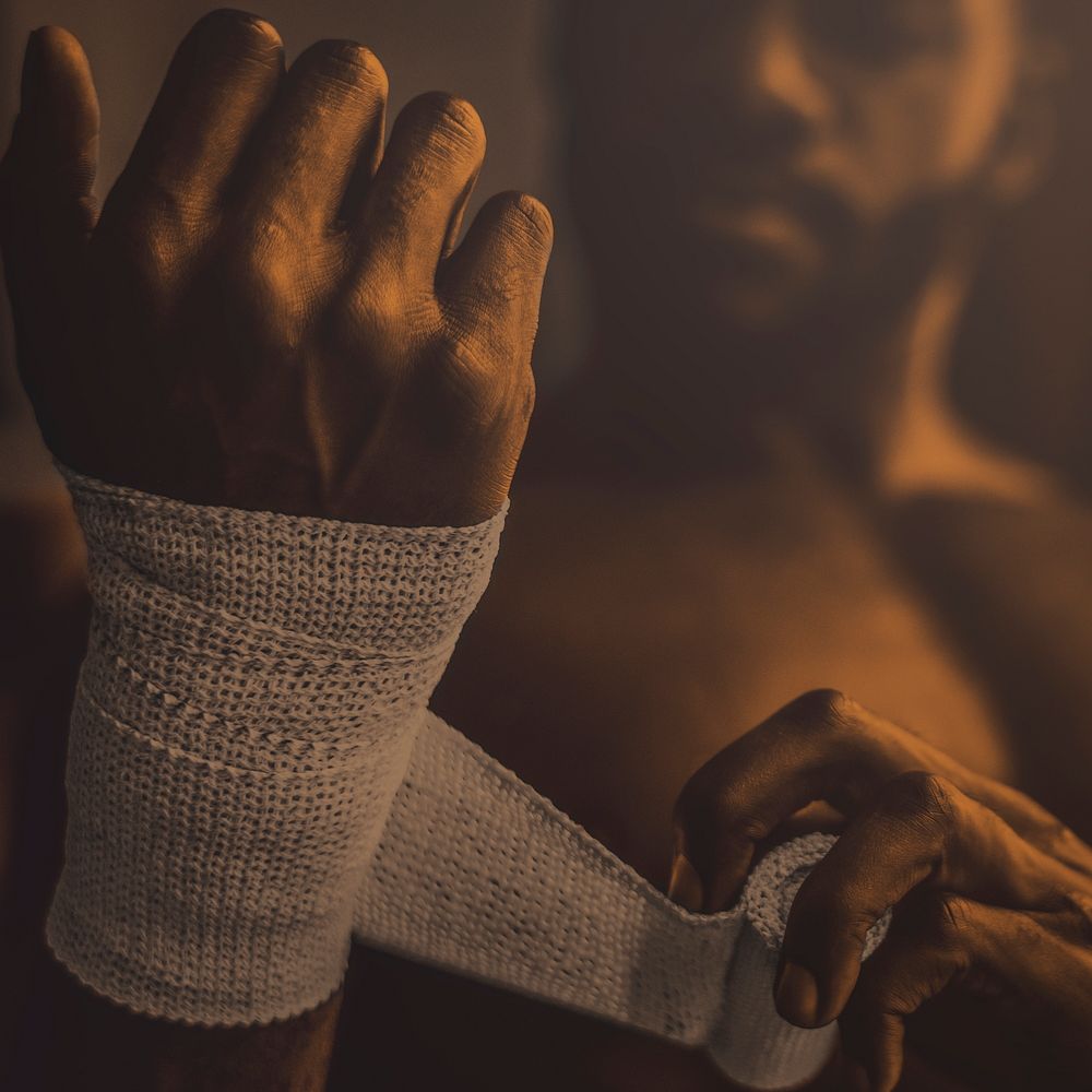 African American man wrapping her hand, ready for weightlifting