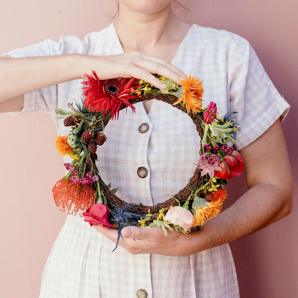 Beautiful woman with a midsummer floral wreath