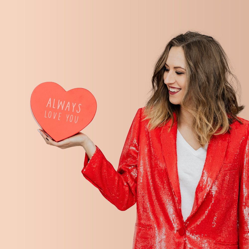 Woman holding a heart mockup social ads template 