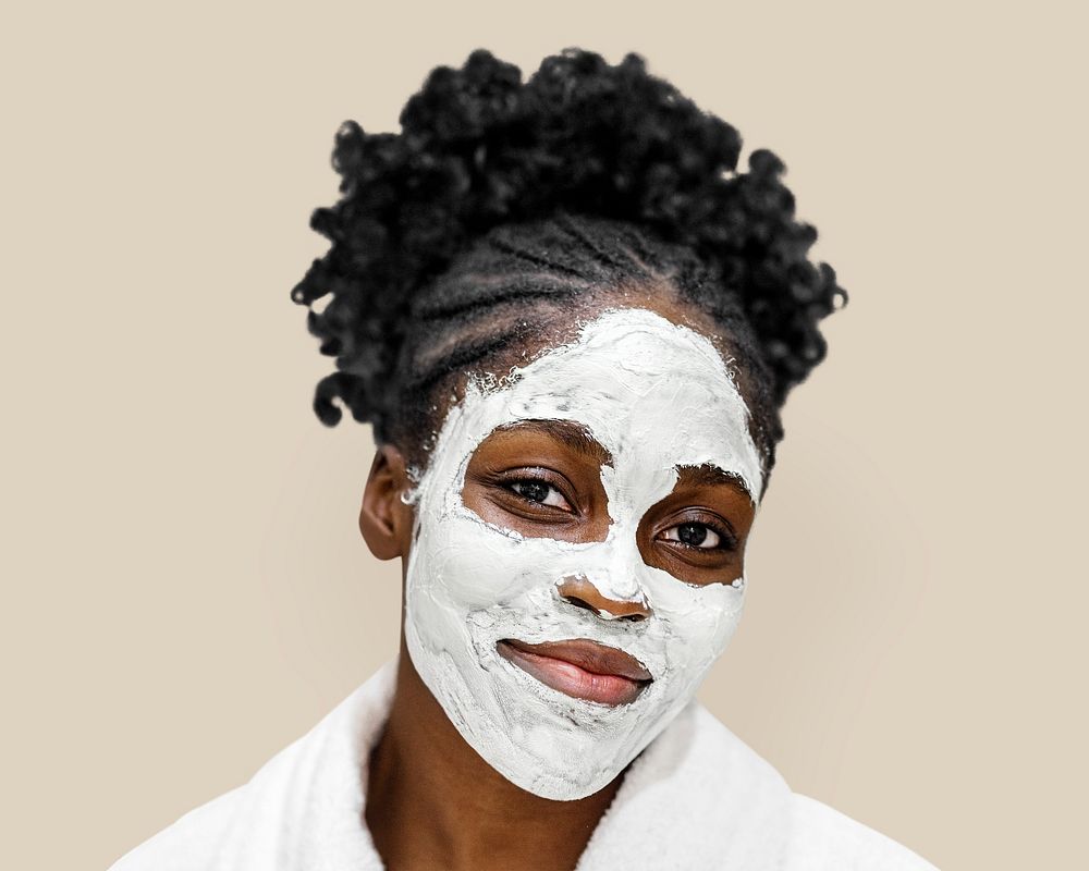 Woman in facial mask isolated on background psd