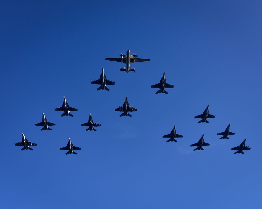 U.S. Navy and Marine Corps aircraft assigned to Carrier Air Wing 11 fly in close formation during a flight demonstration as…