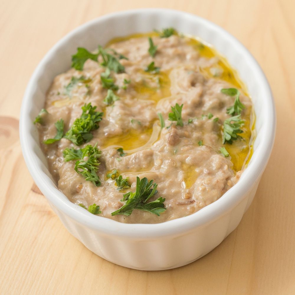 Roasted Eggplant Dip (Baba Ghanoush) with ingredients such as eggplant, parsley, tahini and olive oil from vendors at the…