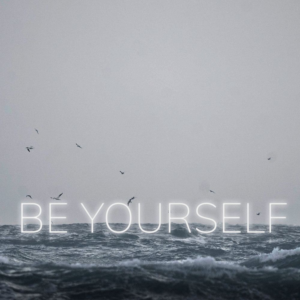 White neon text BE YOURSELF typography