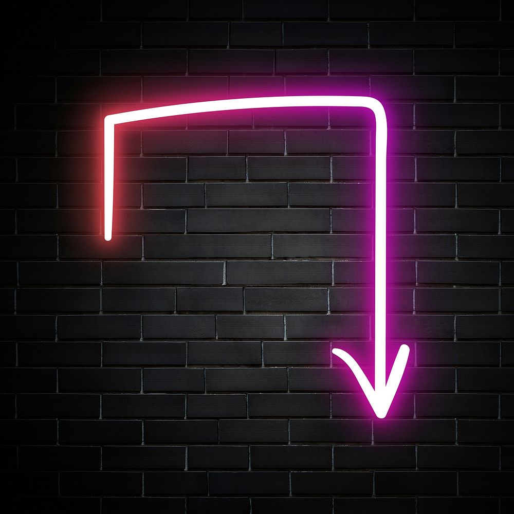 Neon pink turn right arrow sign on brick wall