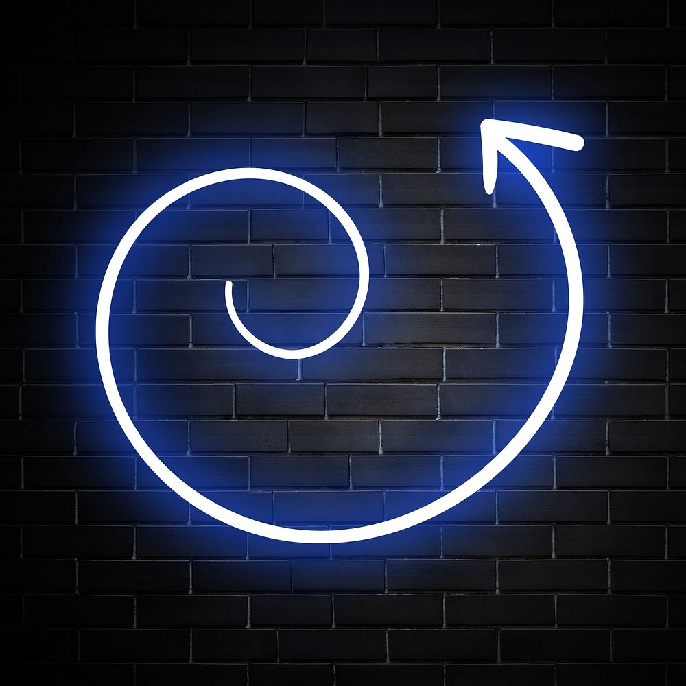 Neon blue swirl arrow sign on brick wall