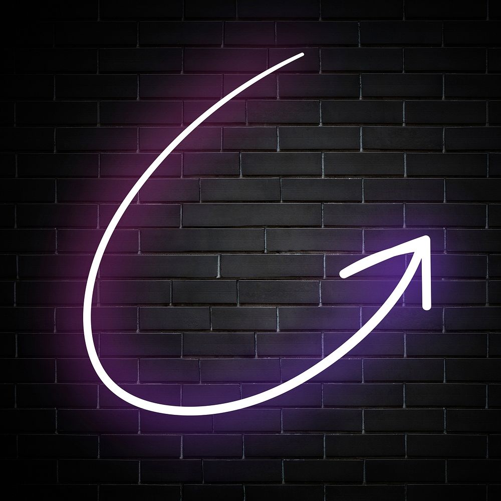 Neon purple curved arrow sign on brick wall