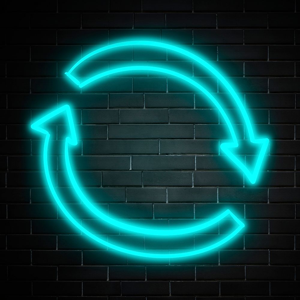 Neon blue circle arrow sign on brick wall
