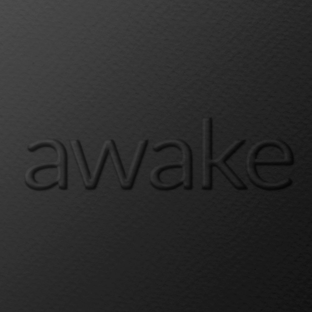 Awake word embossed typography on paper texture