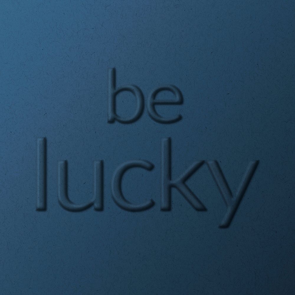 Be lucky message embossed typography on paper texture