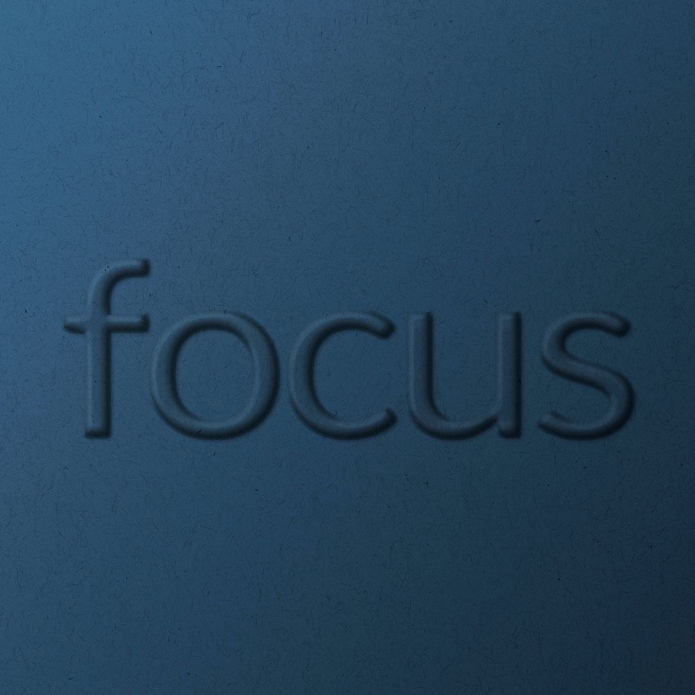 Focus embossed typography on paper texture