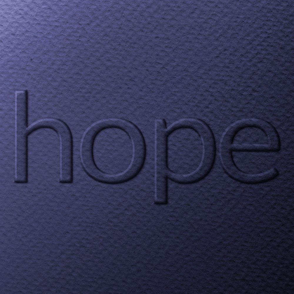 Word hope embossed typography on paper texture