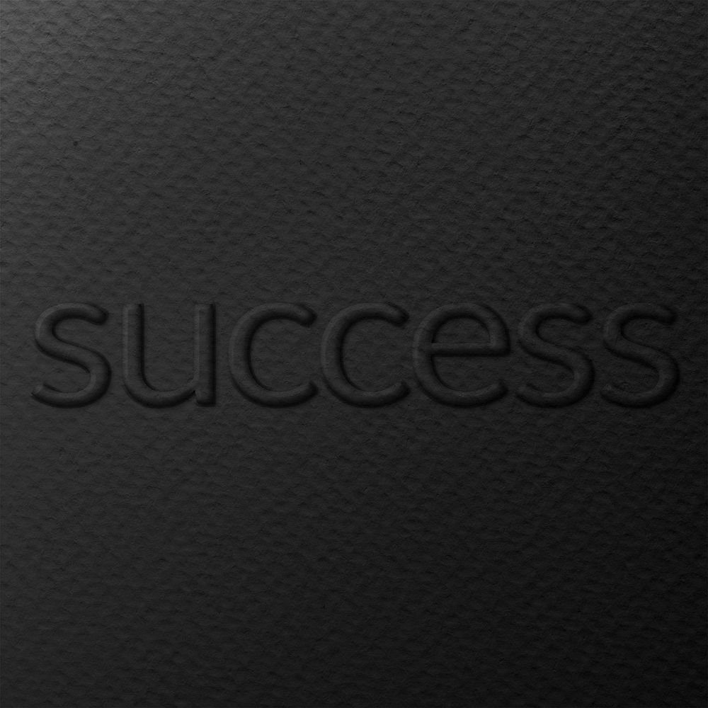 Word success embossed typography on paper texture
