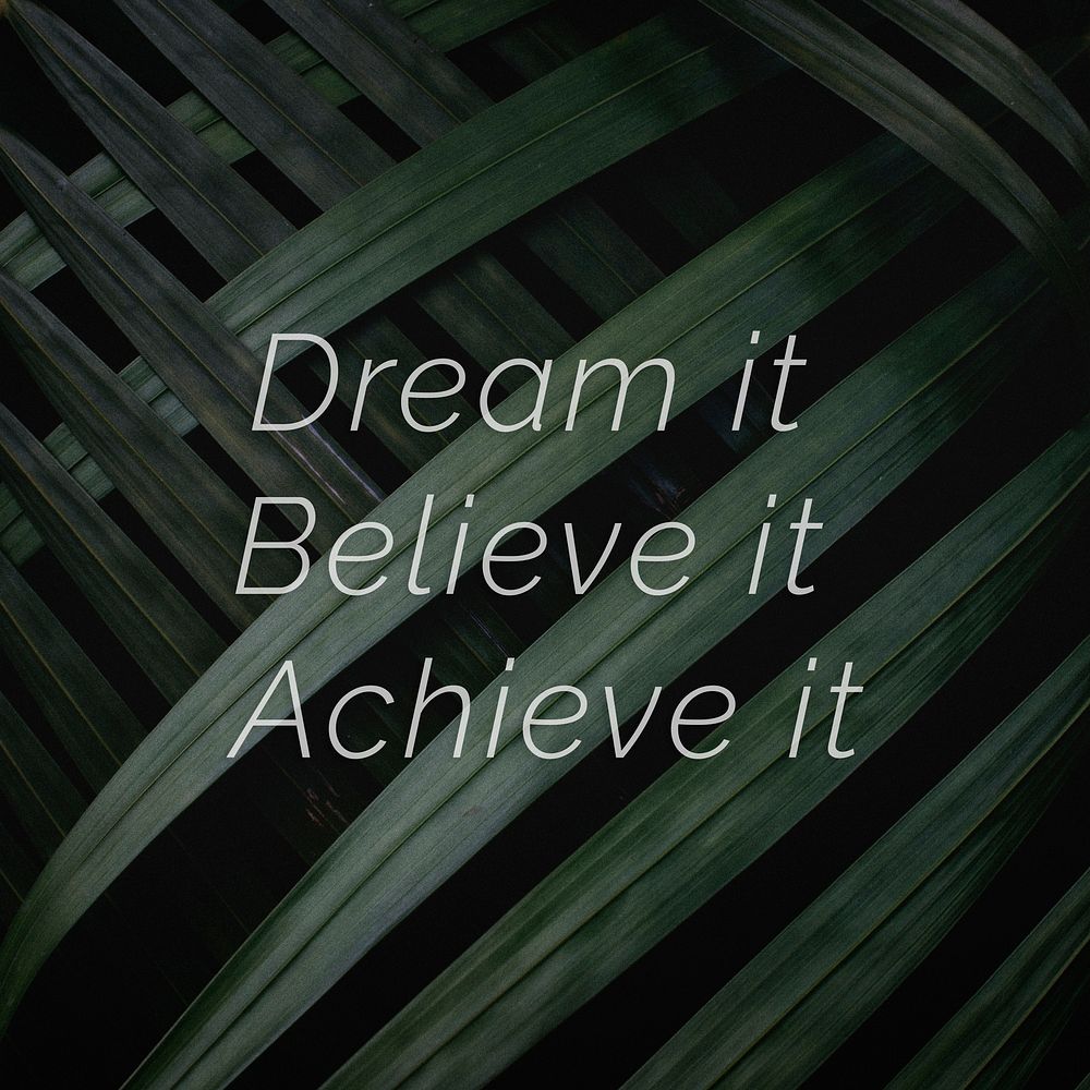 Dream it believe it achieve it quote on a palm leaves background