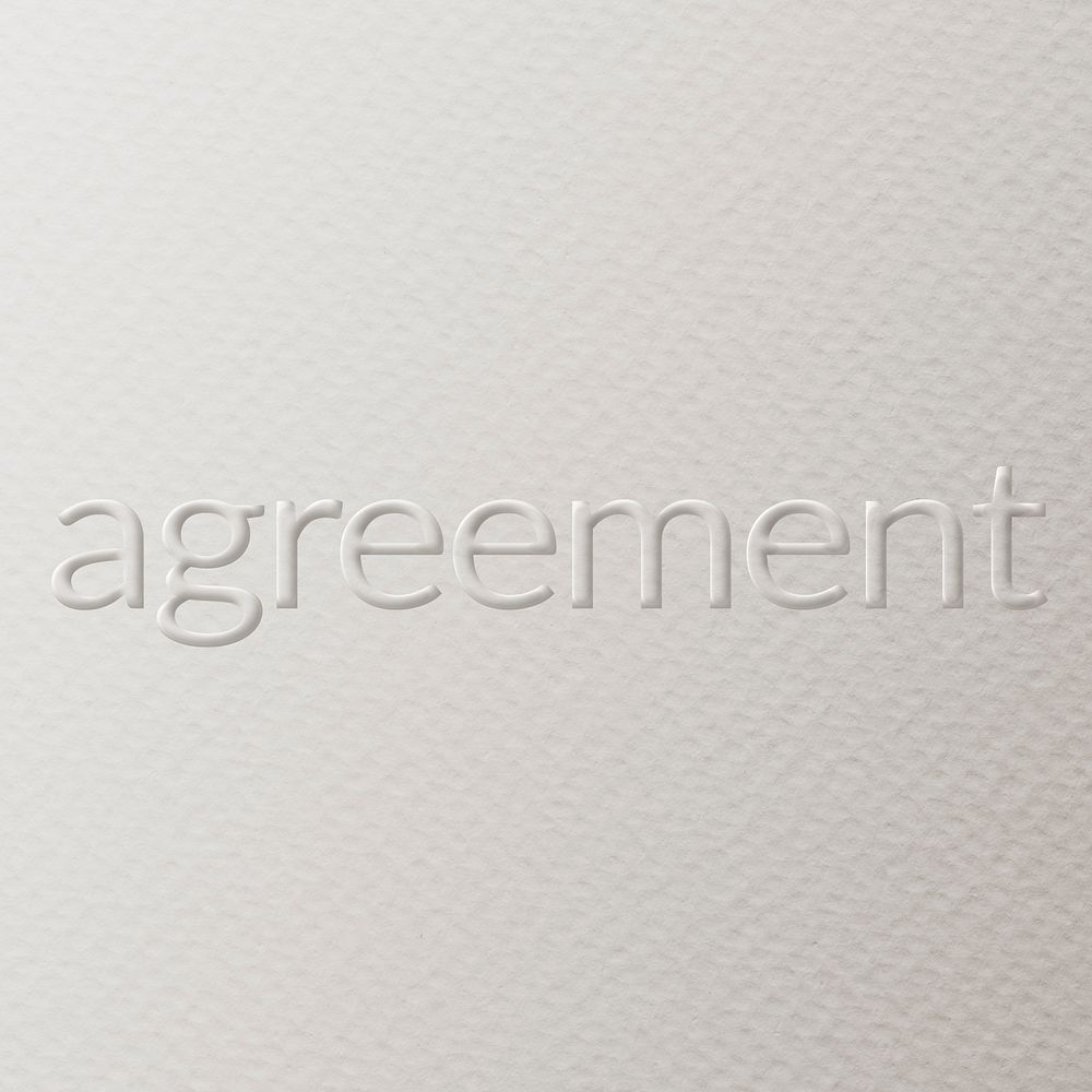 Agreement embossed text white paper background