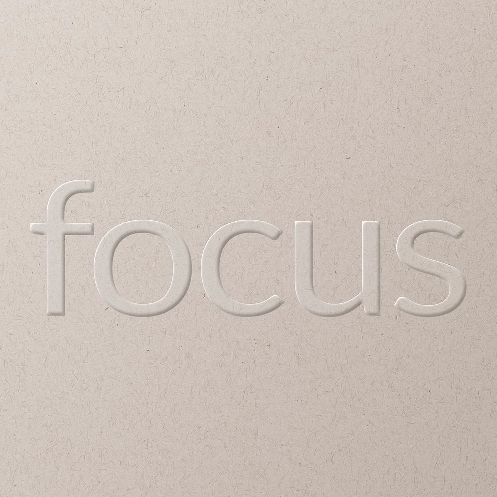 Focus embossed font white paper background