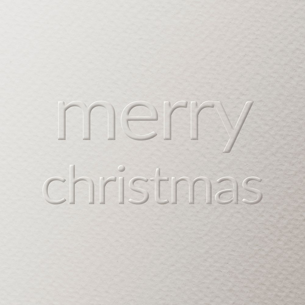Merry Christmas embossed text white paper background