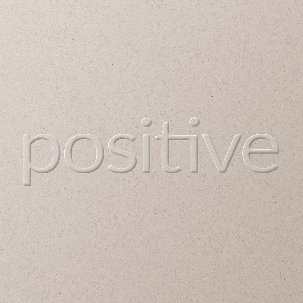 Positive embossed text white paper background