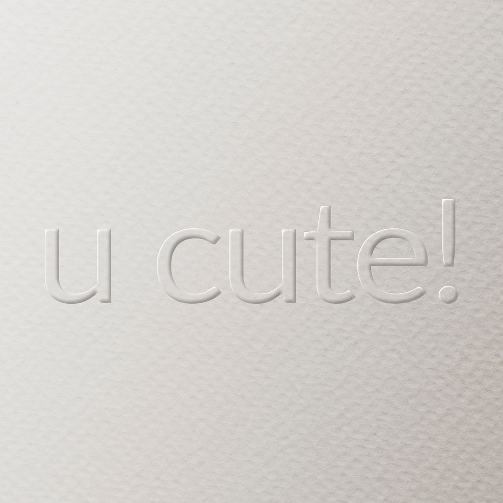 U cute! embossed text white paper background