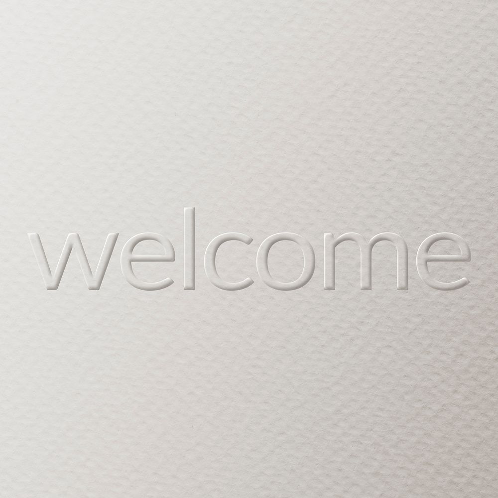 Welcome embossed text white paper background