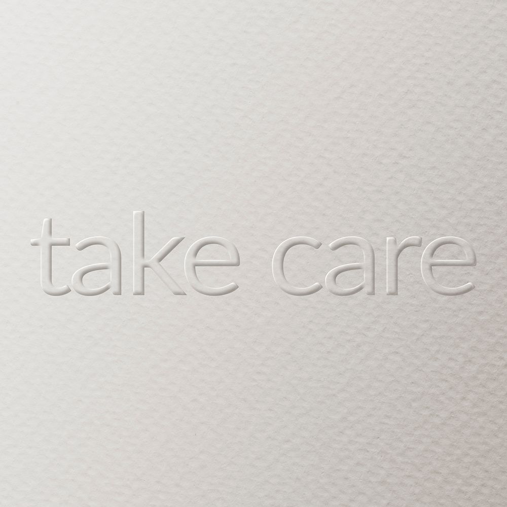 Take care embossed text white paper background