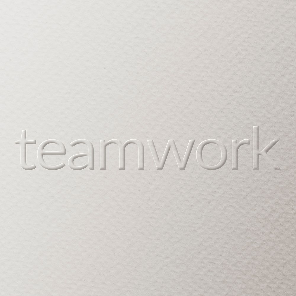 Teamwork embossed text white paper background