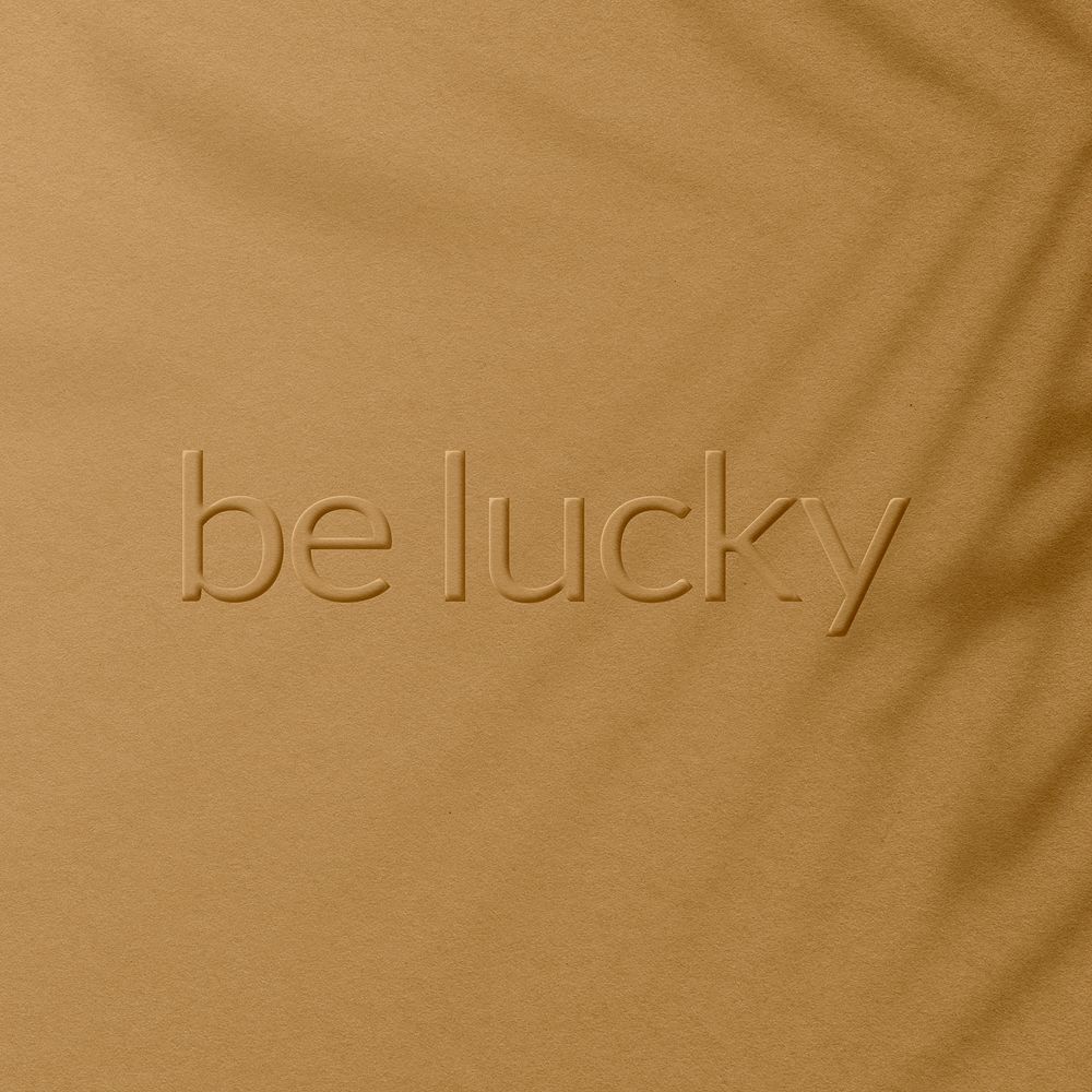 Textured plant shadow backdrop embossed be lucky message typography