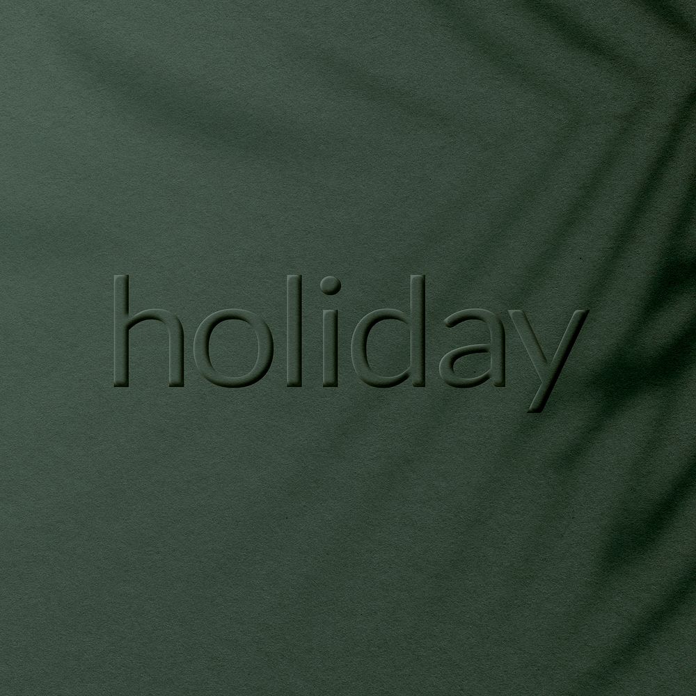 Embossed holiday word textured concrete typography