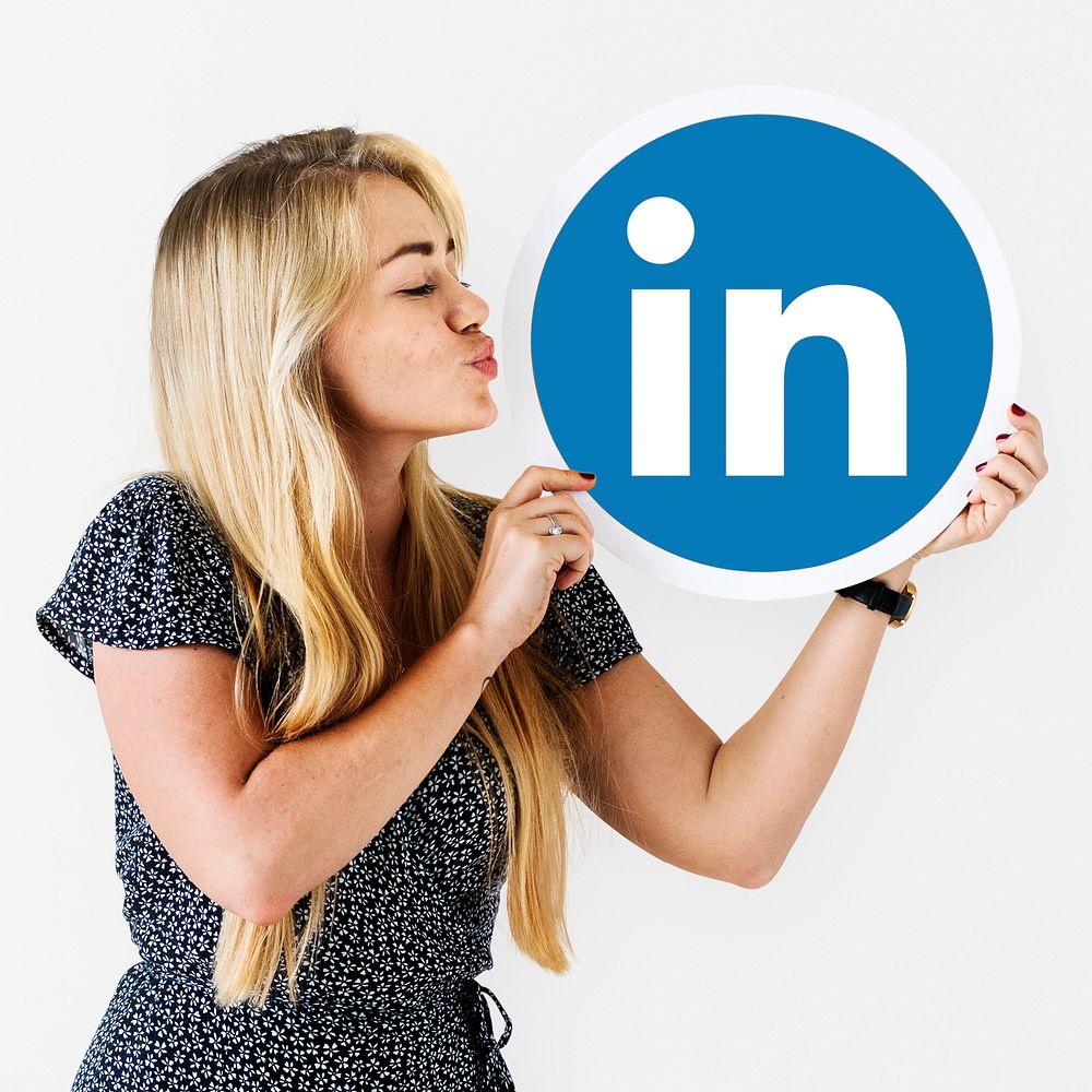 Woman holding a Linkedin icon