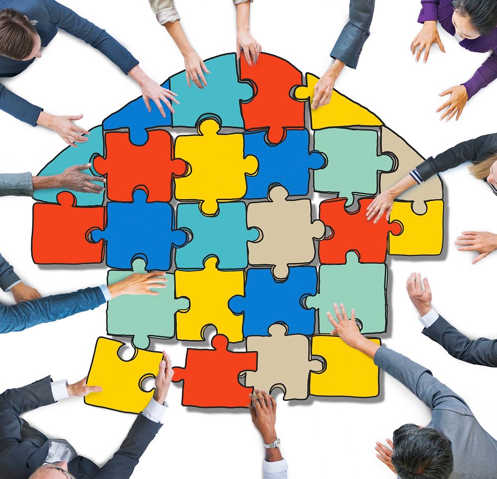 Group of People Forming Home by Jigsaw in Photo Illustration