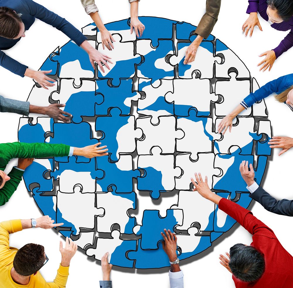 People with Jigsaw Puzzle Forming Globe in Photo and Illustration