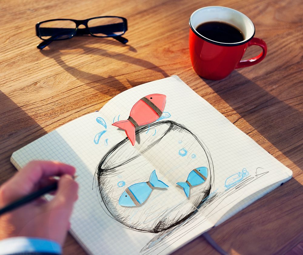 Man Drawing Fishes on a Fish bowl