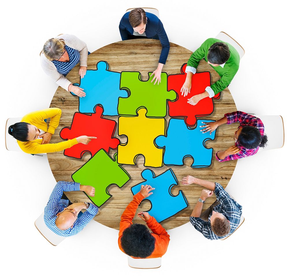 Multiethnic Group of People with Jigsaw Puzzle in Photo and illustration