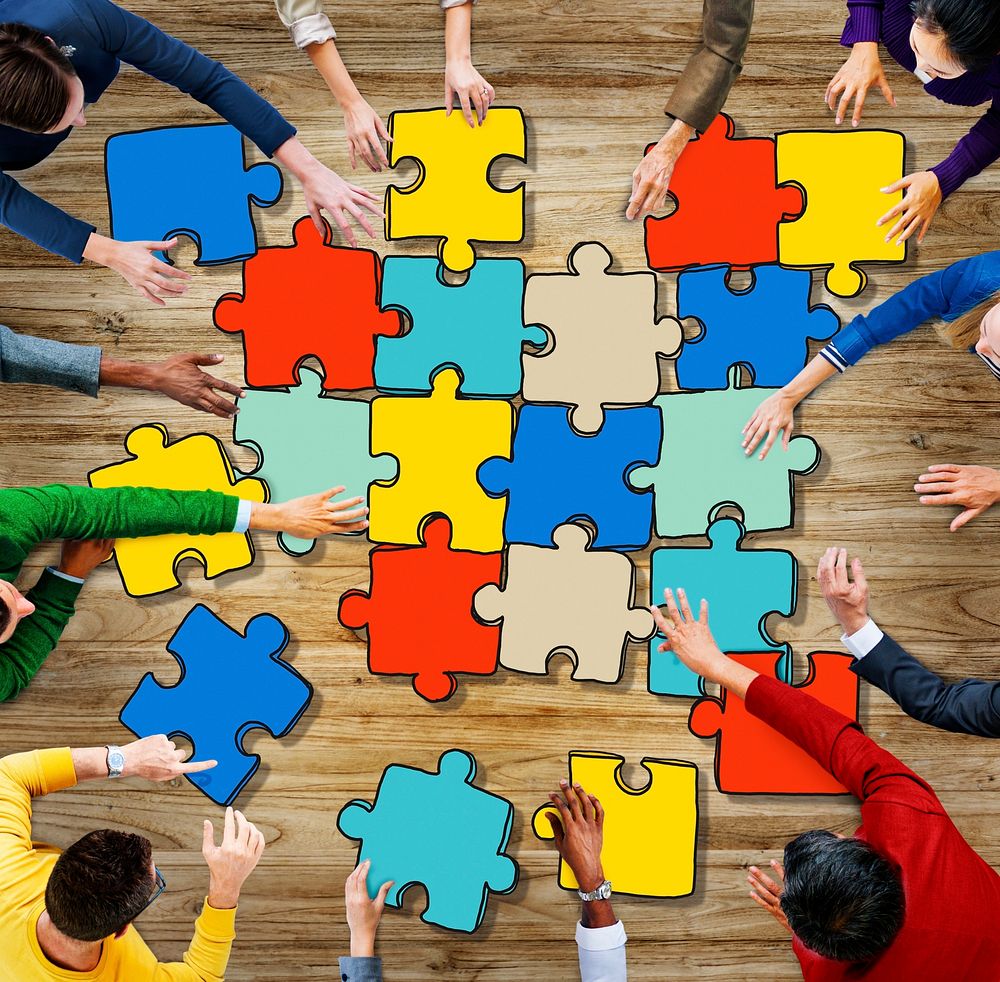 Group of Diverse People with Jigsaw Puzzel Pieces
