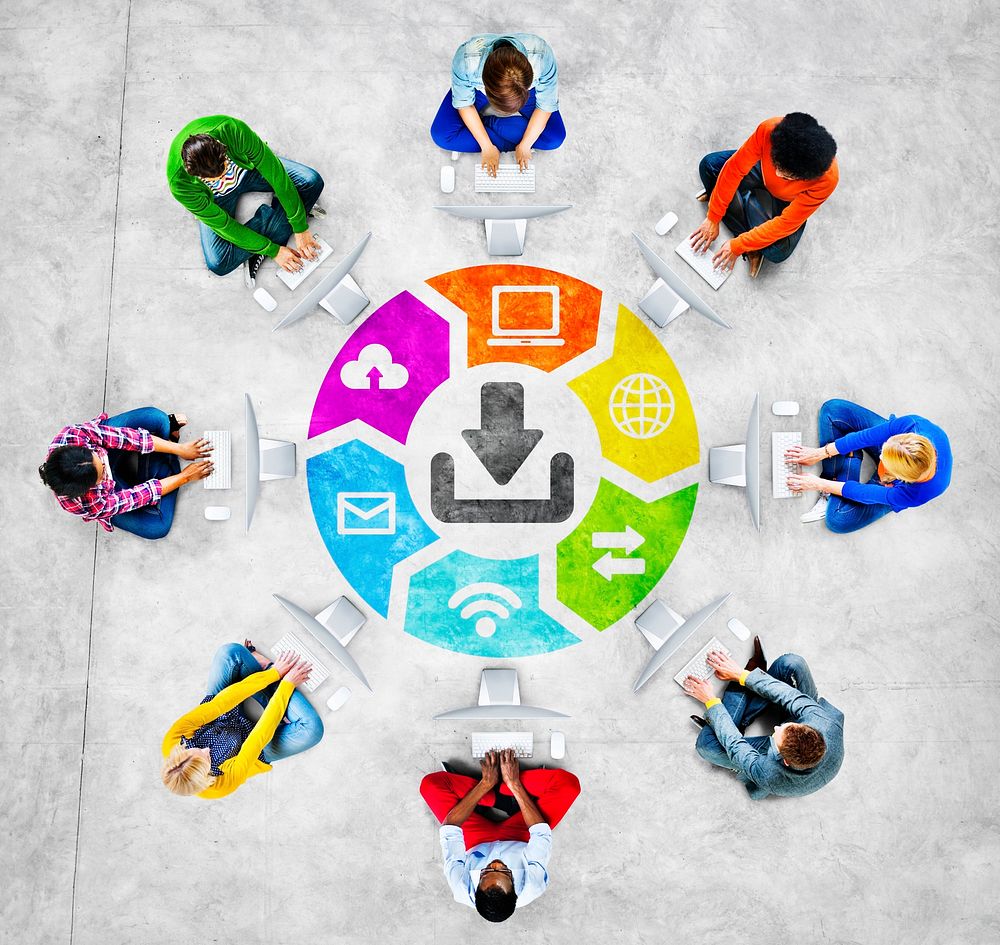 People in a Circle Using Computer with Download Concept