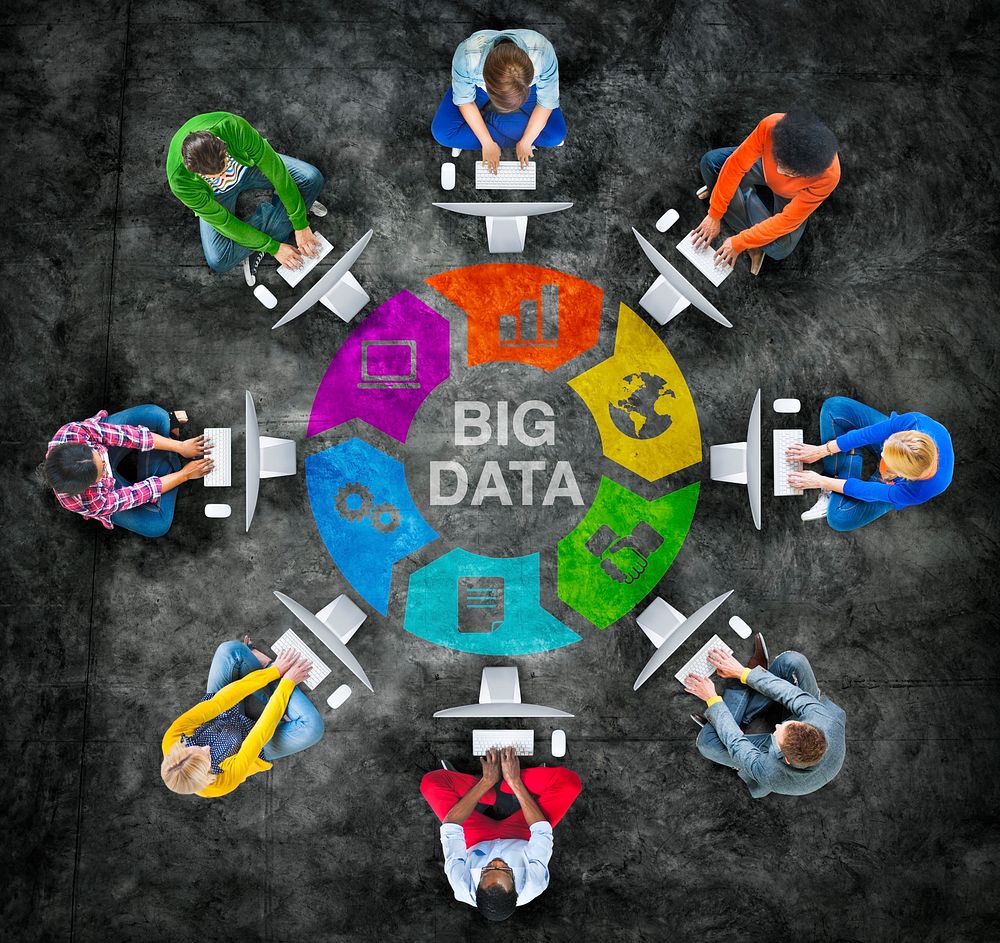 People in a Circle Using Computer with Big Data Concept