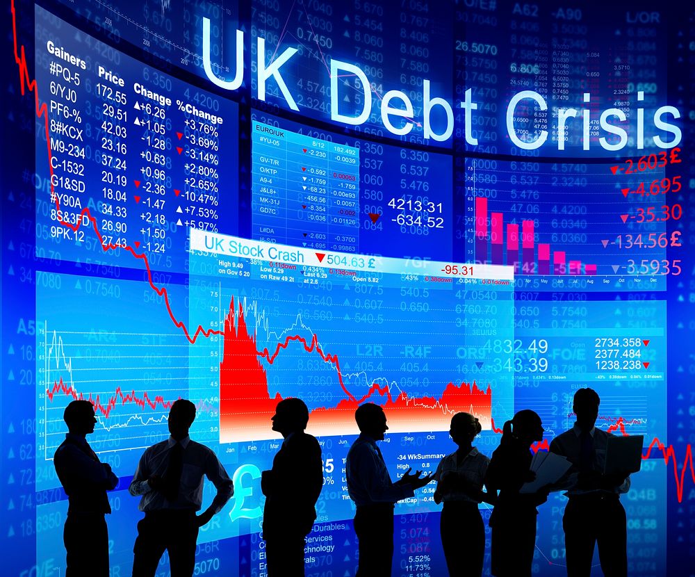 Business People Discussing About UK Debt Crisis