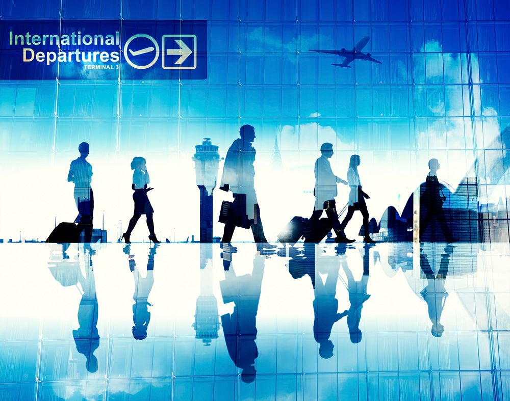 Silhouettes of Business People Walking in an Airport