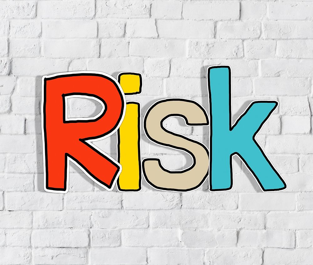 The Word Risk on a Brick Wall Background
