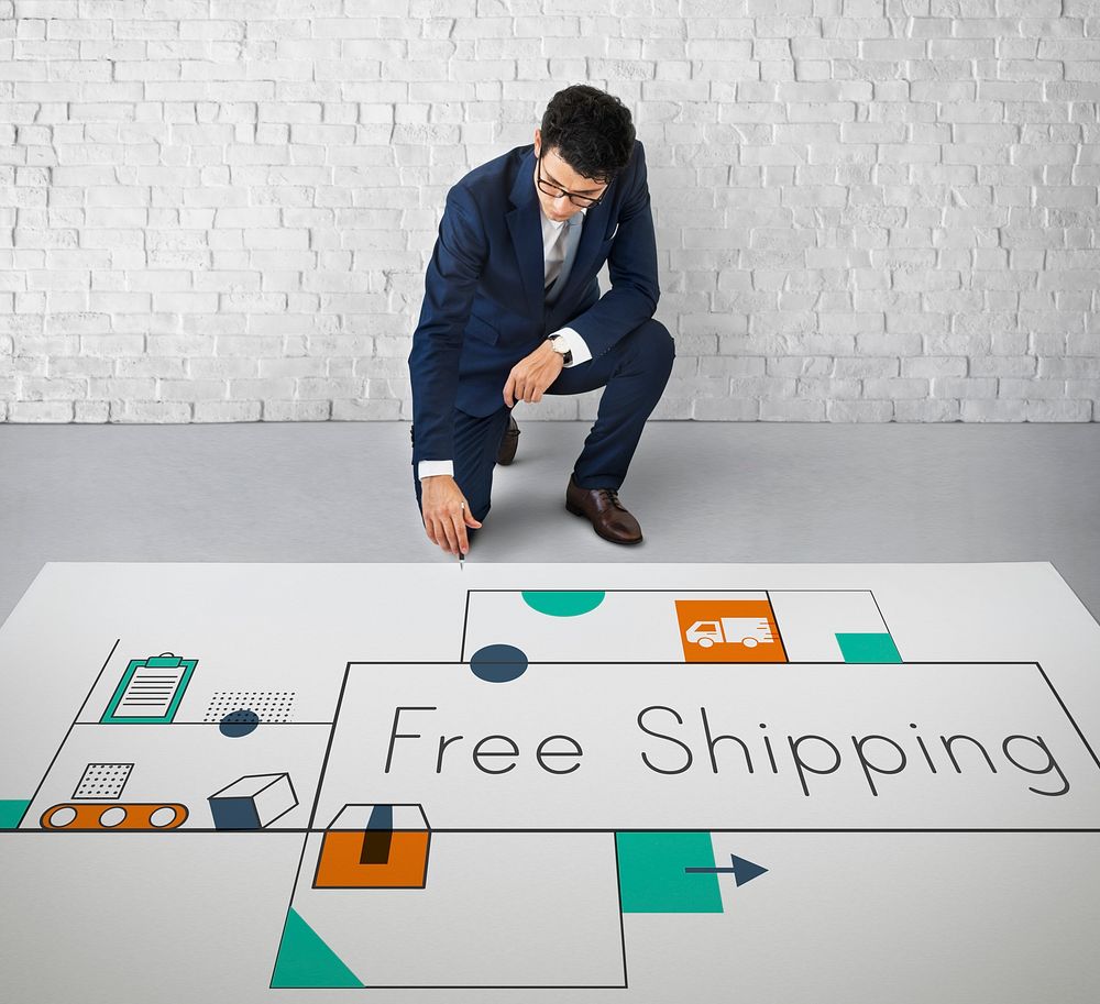 Man working on network graphic overlay banner on floor