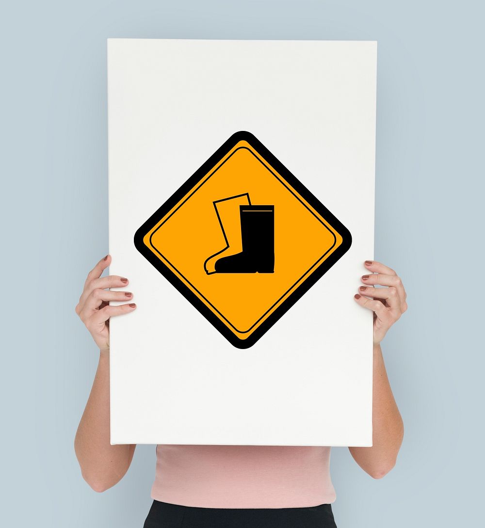 Studio Shoot Holding Banner with Safety Boots Attention Sign