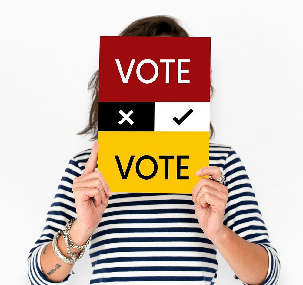 Woman hold vote card cover her face