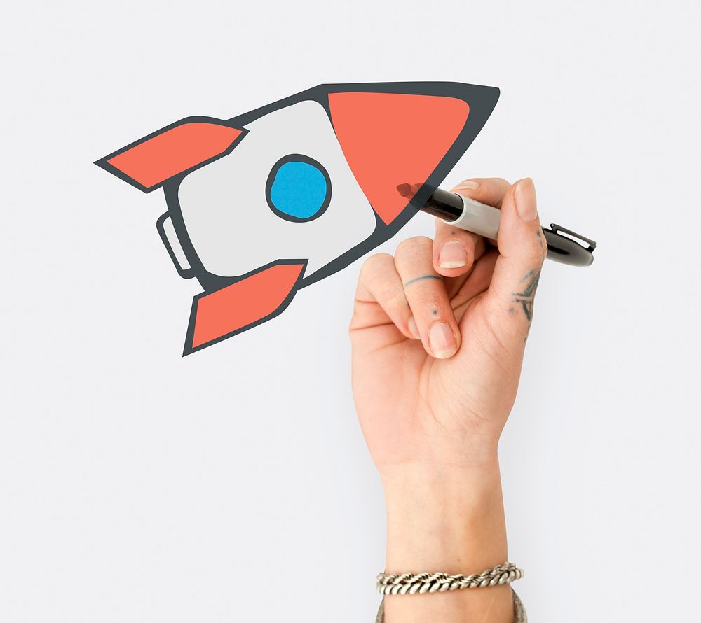 Hand writing board with rocket start up icon
