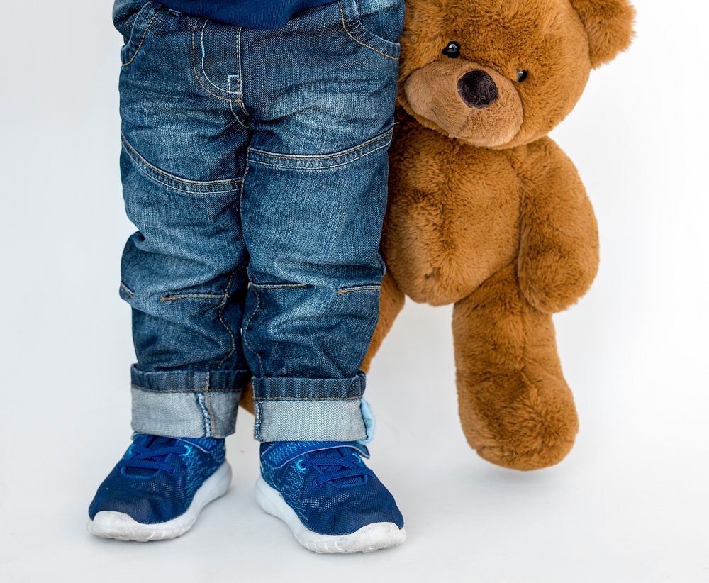 Little Boy Hand Holding Teddy Bear Studio Portrait