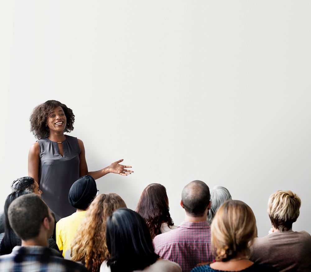 Woman giving a presentation to an audience