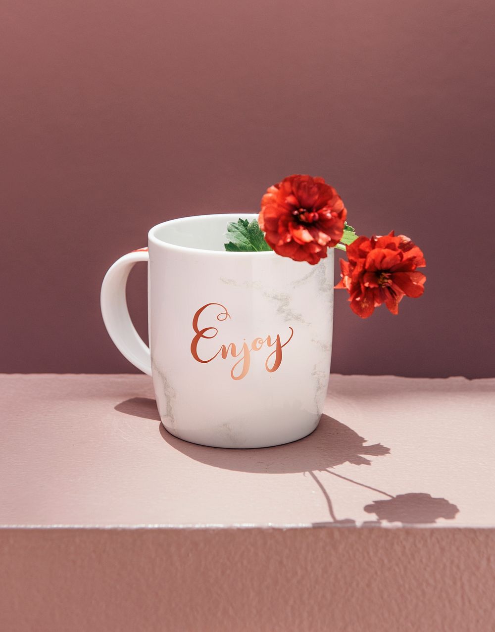 Red peony in a coffee mug