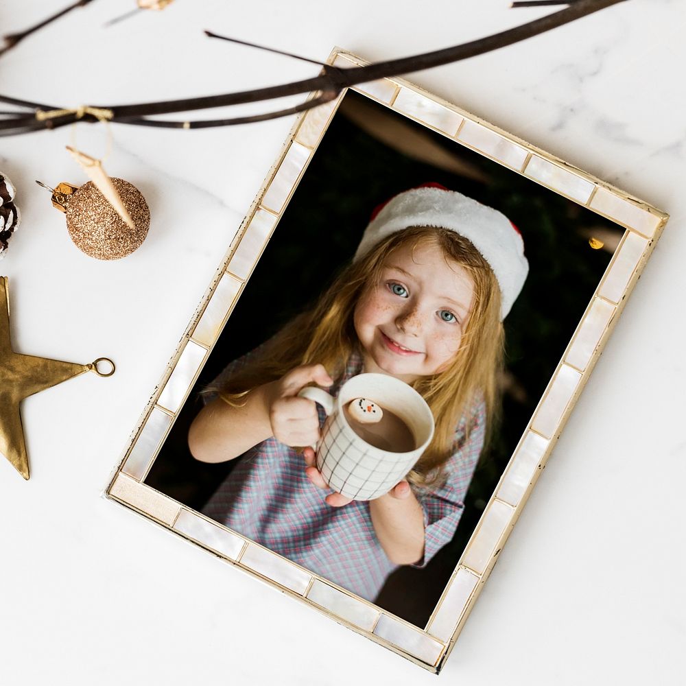 Christmas frame, girl holding hot chocolate cup 